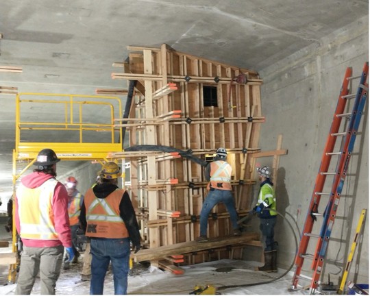 Pouring concrete for one of the block structures that will support the improved post-tensioning system.