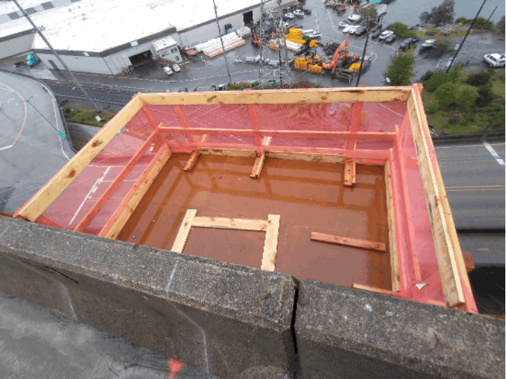 To begin work on new sign bridge foundations, we built work platforms that are secured to the side of the bridge