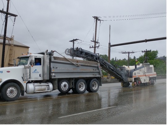 Grinding down sections of the bridge deck to prepare for new concrete. 