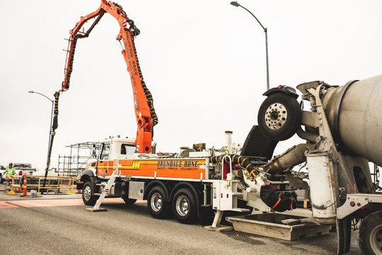 Workers pour concrete into the West Seattle Bridge as part of bridge repairs in May 2022. Photo: SDOT