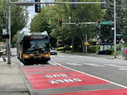 A Route 7 bus traveling in a new red bus-only lane. 