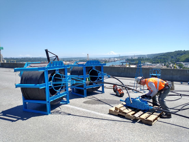 Steel cable is installed through protective pipes as part of the West Seattle Bridge’s newest post-tensioning system. Photo: SDOT.