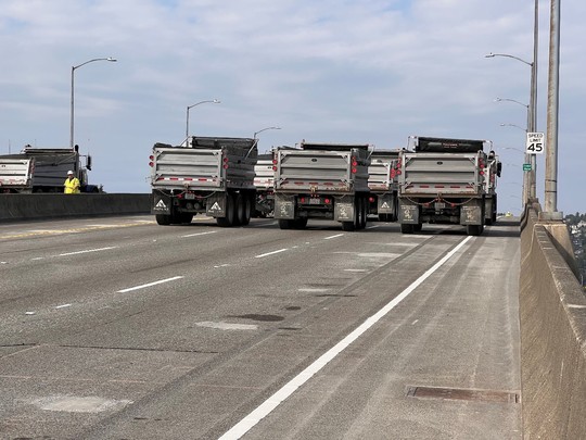 Several large trucks get into position for load testing of the West Seattle Bridge. Photo: SDOT.