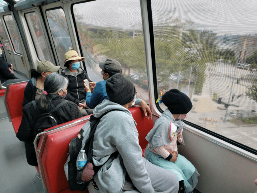 People riding the monorail.