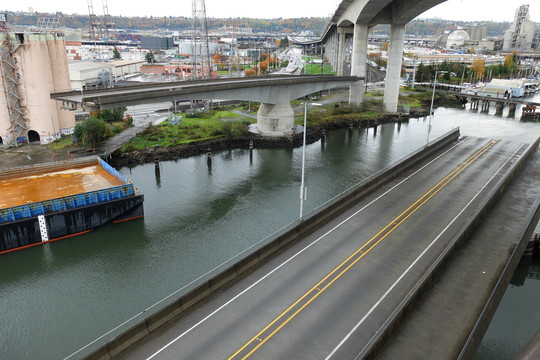The Spokane St Swing Bridge (low bridge) swings open for maritime traffic to pass through. 