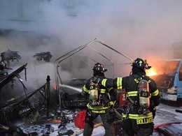 RV fire that extended to three cars and an adjacent building at the 4700 block of Shilshole Ave. NW
