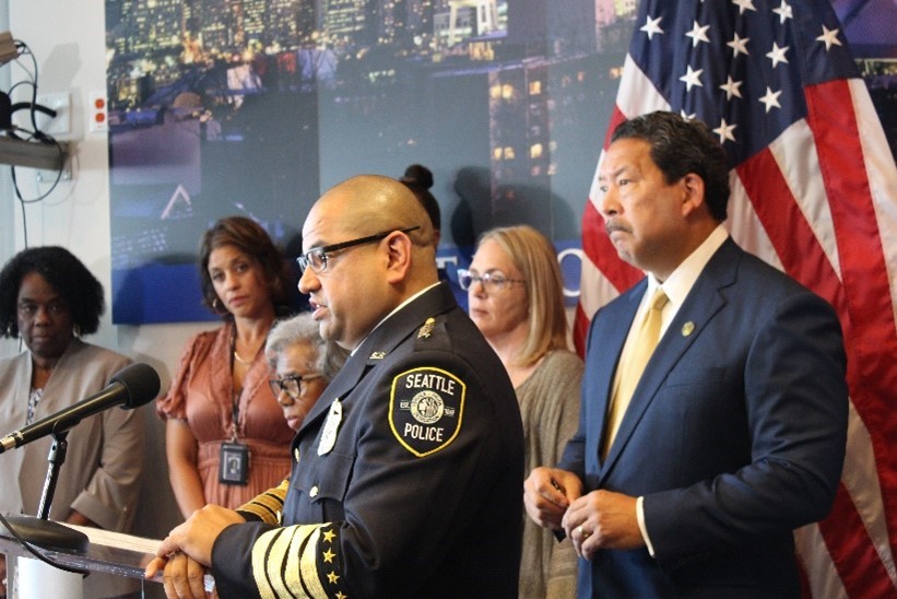 Chief Adrian Diaz speaking behind podium at City Hall.