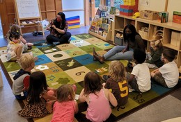 SPP students listening to a story at Creative Kids preschool. 