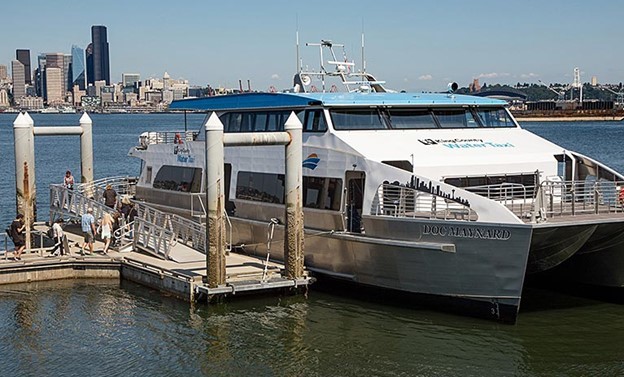 People board the West Seattle Water Taxi at Seacrest dock in West Seattle. Photo credit: King County Metro and Ned Ahrens.