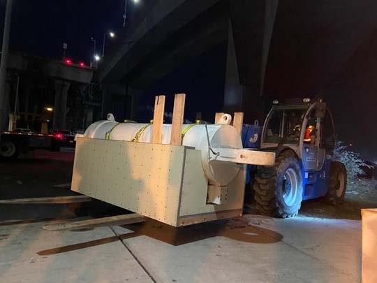 The cylinder loaded onto a forklift. 