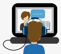 Virtual learning - image of person watching instructor online with head phones