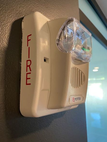 image of an apartment building fire alarm with strobe