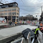 Construction crews working near the intersection of Madison St and 12th Ave