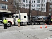 Truck transporting poles