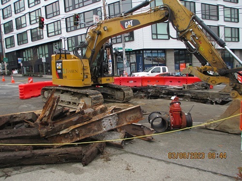 Crews removing old streetcar rails to install new watermain valve