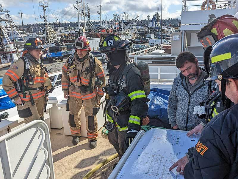 Firefighters participating at the Marine firefighter and damage control class