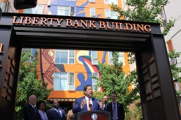 Mayor Harrell underneath the Liberty Bank Building sign