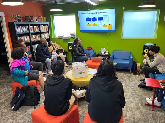 Director Gino Betts Jr. giving a presentation to young people at Black Coffee Northwest's Youth Center