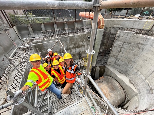 Project team members gathered to celebrate as MudHoney reached the Wallingford shaft.