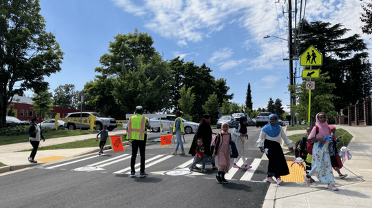 Students at Wing Luke Elementary cross the street with help from the School Patrol.