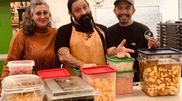 Three Indigenous chefs in a kitchen