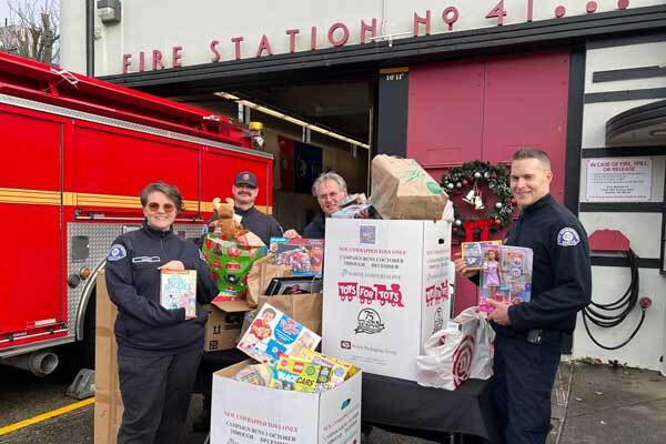 Group photo at Fire Station 41 in Magnolia during the Toys for Tots collection day