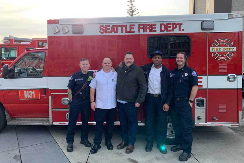 Firefighters and paramedics reunite with the patient they resuscitated, Doctor Mark Staveley