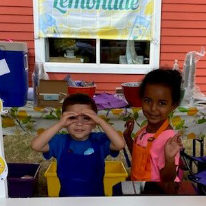 kids selling lemonade at a stand