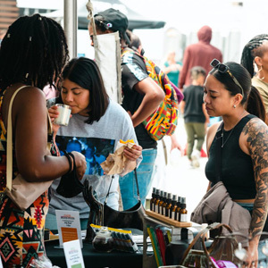 People shopping at a vendor on the waterfront