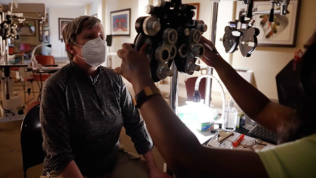 A patient receives an eye exam at the Seattle/King County Clinic