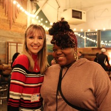 two women attend the mixer event