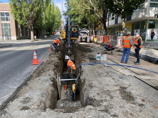 Construction crews working on watermain.