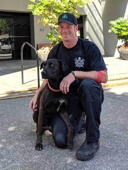 Seattle firefighter Brandon Freeland and his search and rescue dog, Rojo