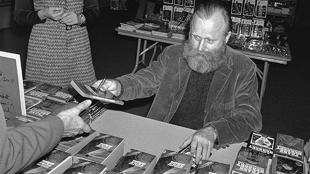 Frank Herbert signs books of "Dune"