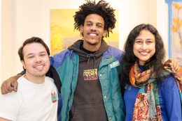 seattle restored three artists pose for camera