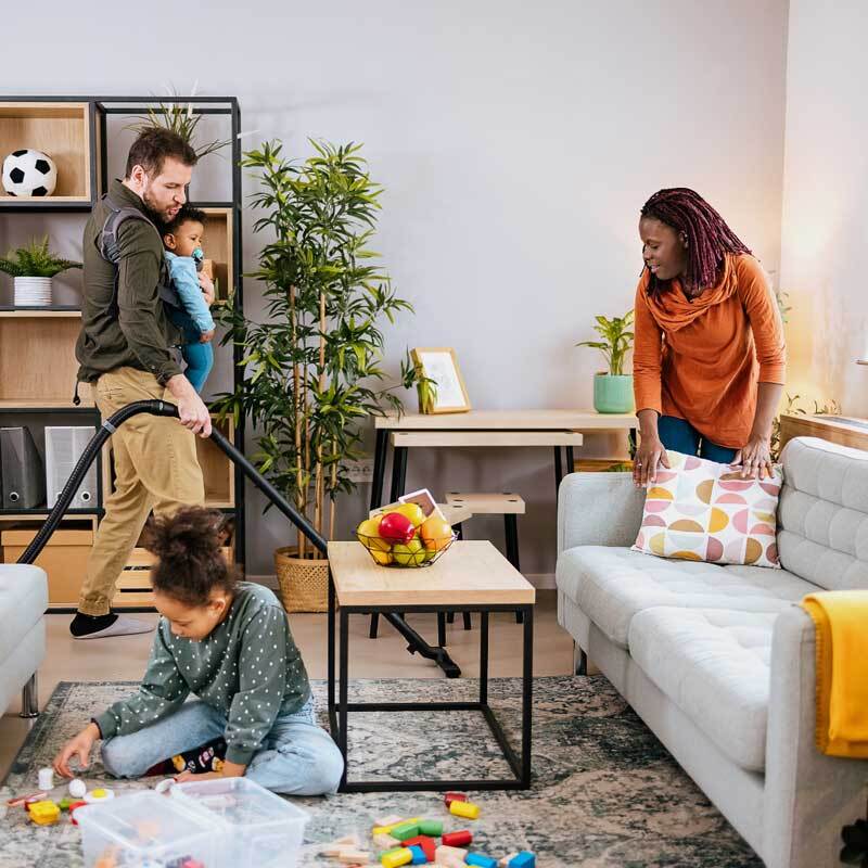 Family spring cleaning their home