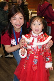 Director of the SPP Dual-Language classroom at CISC Mabel Kwong with student at the Lunar New Year Celebration on February 8.