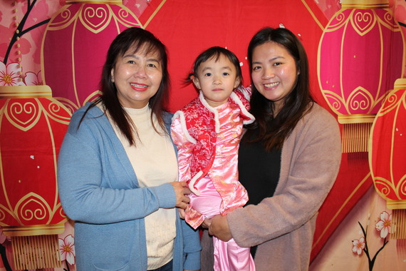 SPP parent Phuong with 3-year-old daughter Emma and her grandmother at the CISC Lunar New Year Celebration on February 8.