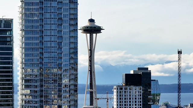 Close-up image of Seattle skyline with Space Needle in center, water in background