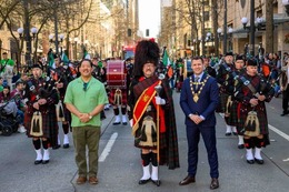 Mayor Harrell poses at the beginning of the St Patrick's Day parade in Downtown Seattle.
