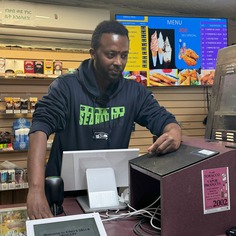 Tewolde at counter of King's Deli