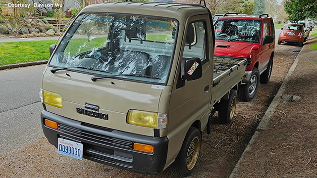 Beige Suzuki pickup truck parked on street