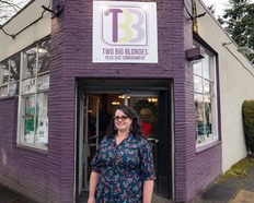 TI Program recipient standing in front of Two Big Blondes store 