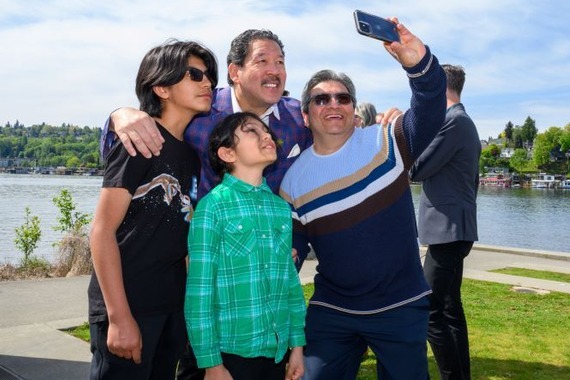 Mayor Harrell takes a photo with residents.