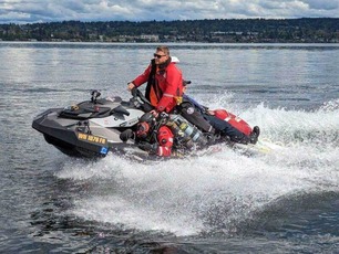 Rescue Watercraft with rescue swimmer on board