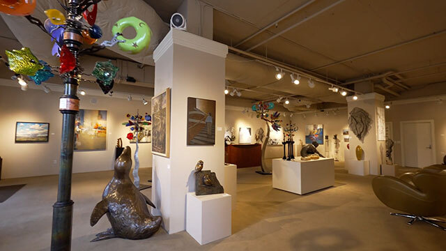 Art gallery with various pieces, seal sculpture in foreground