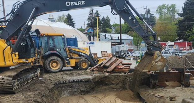 Workers backfill around the mechanical and electrical vault in Fremont.