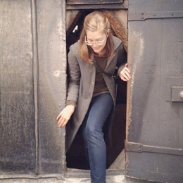 Ali Records walking through a doorway