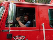 Firefighter Delmari Tyndale drives Ladder 4 down the parade route