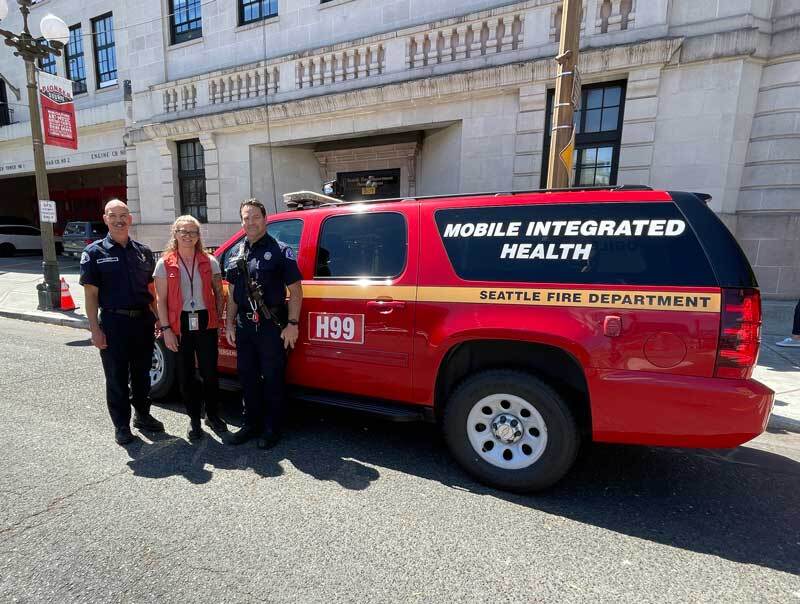 Health 99 crew and apparatus in front of Seattle Fire headquarters